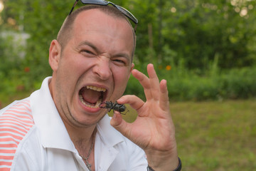Man eating insect © yuliapro6