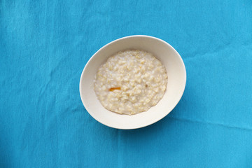 Plate of oatmeal for breakfast on the table