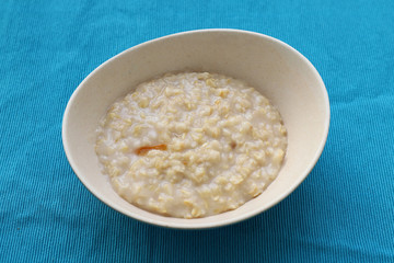 Plate of oatmeal for breakfast on the table