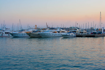 Yachts in the harbour at sunset