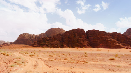 Wadi Rum desert, Jordan, Middle East, known as The Valley of the Moon.  Orange sand, blue sky, haze...