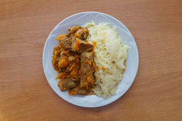 Pasta with pork stew and and carrots