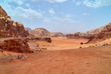 Wadi Rum desert, Jordan, Middle East, The Valley of the Moon. Orange sand, haze, clouds....