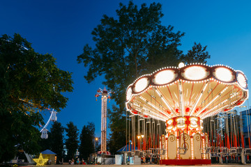 Carousel Merry-Go-Round. Summer Evening In City Amusement Park.