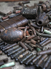Military background with cartridges of grenades and machine-gun tape. Black archeology. World War II and its artifacts. Great Patriotic War of the USSR