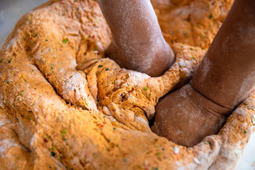 Turkish women preparing Tarhana. Tarhana is a Turkish soup made from a fermented and dehydrated mix of flour, yogurt, onions, tomatoes and green peppers. 