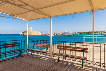 Viewing platform with benches. Port of Rhodes town. Greece