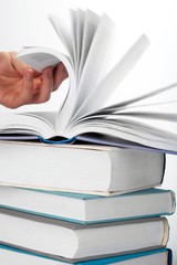 Open book on stack of books