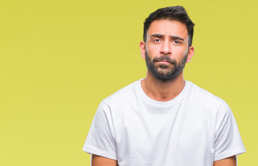 Adult hispanic man over isolated background depressed and worry for distress, crying angry and afraid. Sad expression.