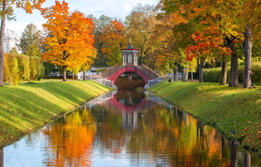 Cross bridge in golden fall in Alexander park, Pushkin, Saint Petersburg, Russia