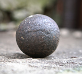 Ancient core for cannons and bullets. Antique historical artifact from the Middle Ages.