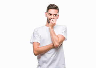 Young handsome man over isolated background looking stressed and nervous with hands on mouth biting nails. Anxiety problem.