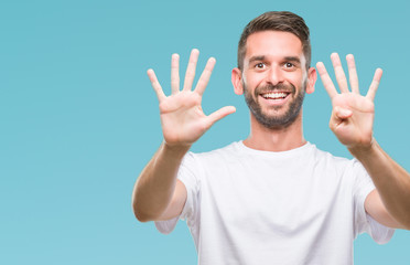 Young handsome man over isolated background showing and pointing up with fingers number nine while...