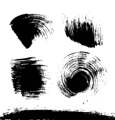 Black textured smears of different forms set isolated on a white background