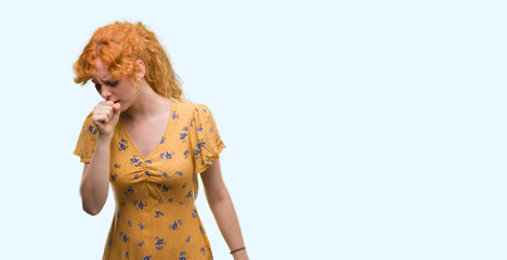 Young redhead woman feeling unwell and coughing as symptom for cold or bronchitis. Healthcare concept.