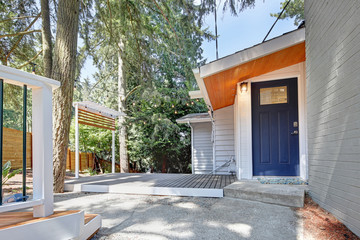 Fototapeta na wymiar Home entrance with blue front door.