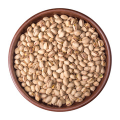 Plate with salted pistachios isolated on white background.