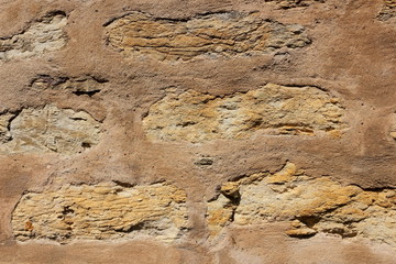 Natural background, ancient wall of the medieval city, the wall of an ancient temple in Prague, stone masonry test with cement, blank for designer