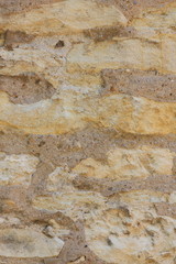 Natural background, ancient wall of the medieval city, the wall of an ancient temple in Prague, stone masonry test with cement, blank for designer