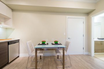 Dining table set for two in a modern kitchen. Interior design.