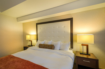Modern master bedroom in a luxury house, hotel. Interior design.