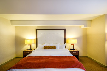 Modern master bedroom in a luxury house, hotel. Interior design.