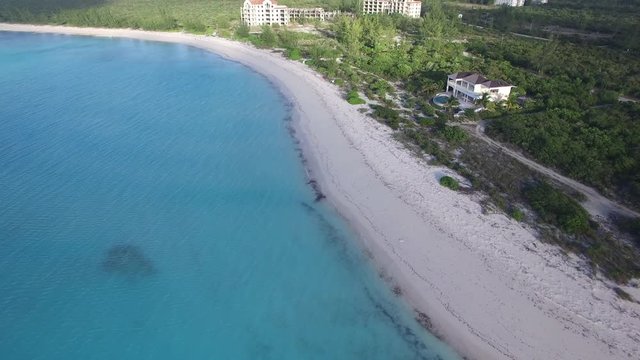 Tilt up aerial, coastal hotel in Turks and Caicos