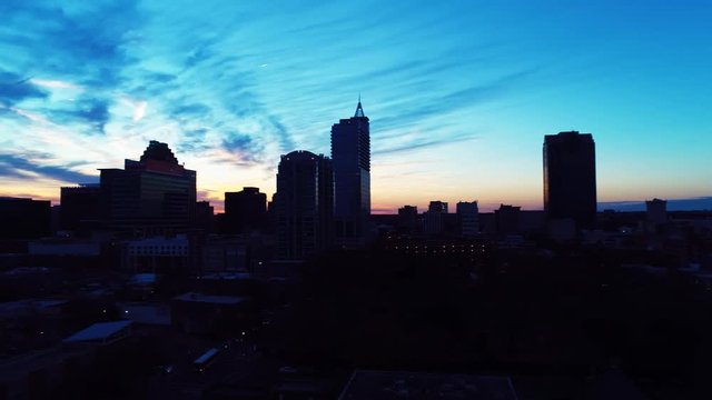 Sunset over Raleigh cityscape, aerial