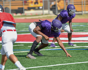 Football Linemen bolocking and rushing in a game