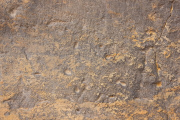 Texture old wall. Surface of an ancient temple in Prague. Background of stone for the designer. Vintage pattern in brown tones