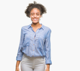 Young afro american woman over isolated background winking looking at the camera with sexy...