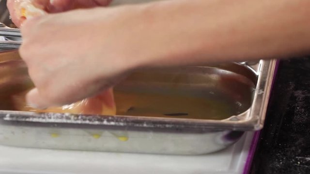 Preparing homemade chicken kiev in a kitchen
