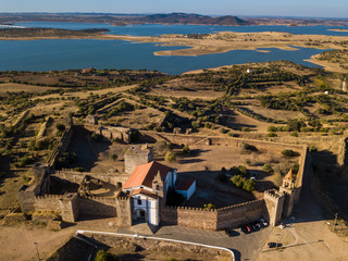 The castle of Mourao with the big lake behind