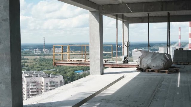 View of the city from an unfinished multi-storey building.
