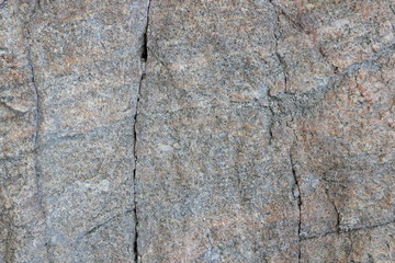 Granite texture. Granite stone close up. Background of natural material. Rocky rocks of ancient times. Natural pattern