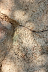 Granite texture. Granite stone close up. Background of natural material. Rocky rocks of ancient times. Natural pattern