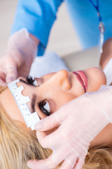 Female ophthalmologist is checking up female patient in eye doct