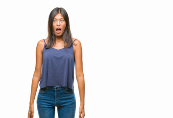 Obraz premium Young asian woman over isolated background afraid and shocked with surprise expression, fear and excited face.