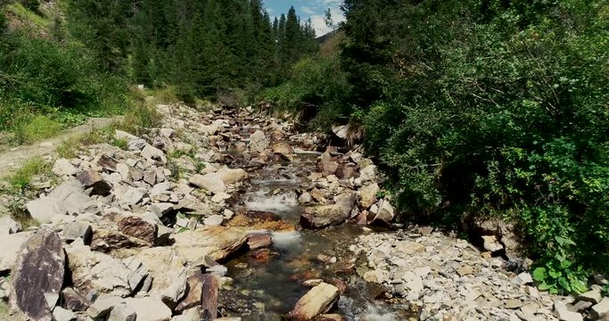 Drone flight in summer over mountain stream in the Nockberge mountains in the Thunder Gorge in Carinthia in innerkrems, lungau, schoenfeld