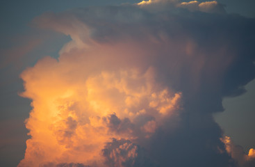 Tokyo,Japan-August 26, 2018: Gigantic cumulonimbus incus or anvil illuminated by the setting sun
