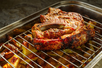 cooked meat with potatoes fried in the oven