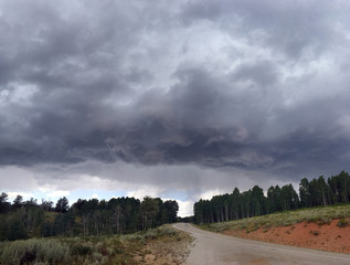 storm clouds roll by in northern utah mountain range near ogden and salt lake city