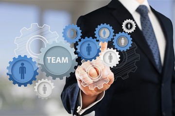 Businessman and  analytics symbols on  background
