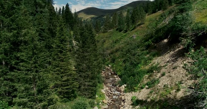 Drone flight in summer over mountain stream in the Nockberge mountains in the Thunder Gorge in Carinthia in innerkrems, lungau, schoenfeld
