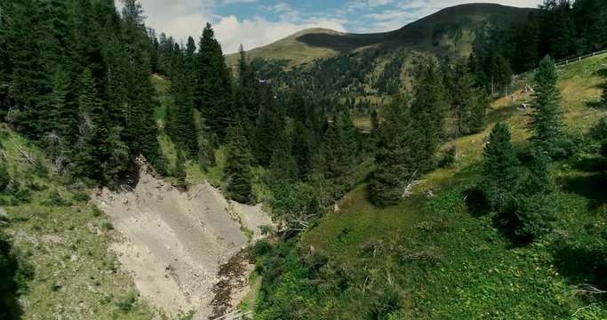 Drone flight in summer over mountain stream in the Nockberge mountains in the Thunder Gorge in Carinthia in innerkrems, lungau, schoenfeld