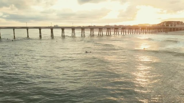 Aerial, sunset over ocean pier