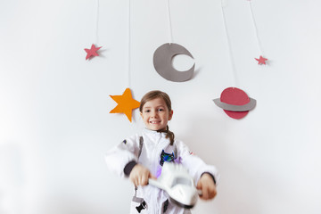 playful little girl who wants to become a space traveler