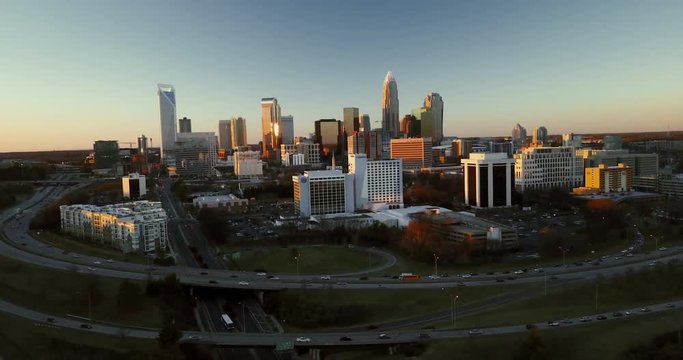 Sunset over Charlotte skyline, wide aerial
