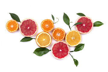 Fototapeta na wymiar Citrus fruits isolated on white background. Isolated citrus fruits. Pieces of lemon, pink grapefruit and orange isolated on white background, with clipping path. Top view