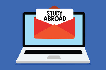 Word writing text Study Abroad. Business concept for Pursuing educational opportunities in a foreign country Computer receiving email important message envelope with paper virtual